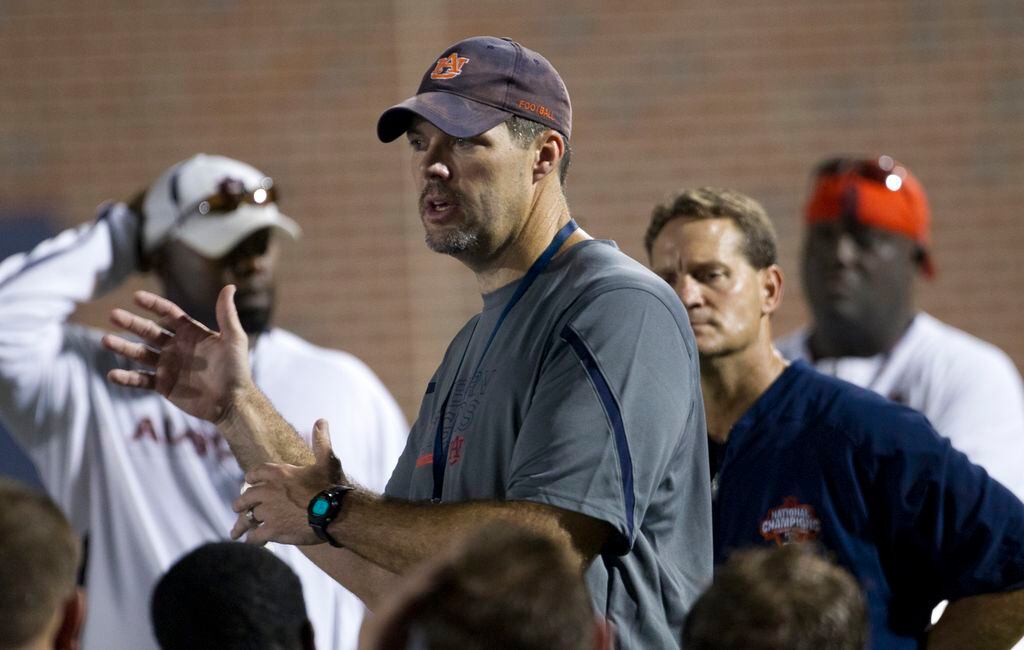 FILE - This Aug. 3, 2011 file photo shows Auburn offensive line coach Jeff Grimes during the first day of fall practice for the Auburn Tigers,  in Auburn, Ala. Grimes has a different approach to coaching offensive linemen.  (AP Photo/Dave Martin, FIle)